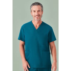 A unisex teal V-neck scrub top with a pocket, worn by a model. The top features a simple design and a logo.