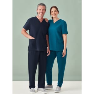 A unisex V-neck scrub top in teal and navy, displayed on male and female models. Both feature pockets.