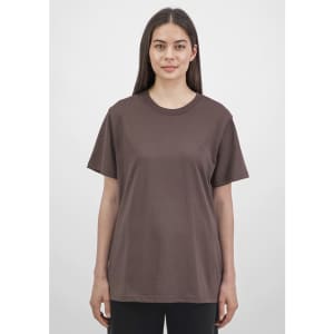 A brown short sleeve women's tee displayed on a model, featuring a simple design and relaxed fit.