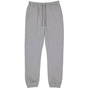 Grey track pants with an elastic waistband, drawstring, and side pockets. Features a brand logo on the waistband.