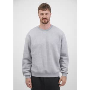A men's crew sweatshirt in grey, featuring long sleeves and a classic fit, displayed by a model.