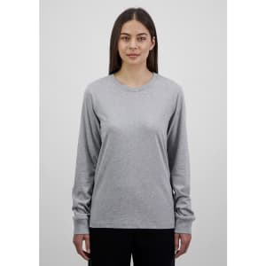 A long sleeve women's tee in grey, featuring a round neckline and a fitted design. It has a logo on it.