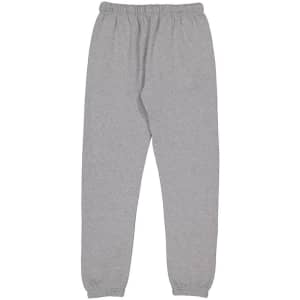 Grey women's track pants with an elastic waistband and tapered cuffs, featuring a logo.