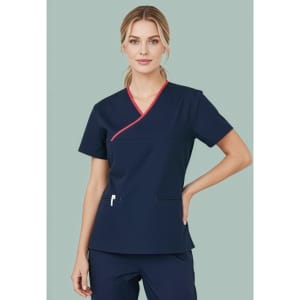 A women's scrub top in navy with contrast red detailing, featuring a crossover design and a logo.