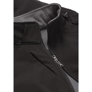 A soft shell jacket in dark grey with a light grey interior, featuring a high collar and zippered pockets.
