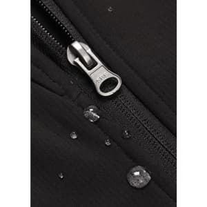 A close-up of a black soft shell jacket featuring a zipper and droplets of water on the fabric.