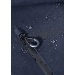 A navy blue rain jacket with water droplets on the fabric, featuring a zipper and a branding label.