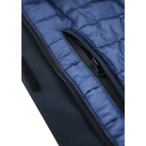 A men's jacket featuring navy blue insulation and a zippered pocket, designed as a rain jacket. It has a logo.