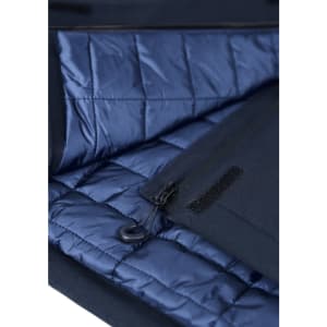 A navy blue insulated jacket interior features quilted lining and a zippered pocket. Includes a logo on the exterior.