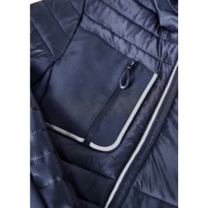 A navy unisex patrol jacket featuring a zippered chest pocket and quilted design. Logos are visible on the jacket.