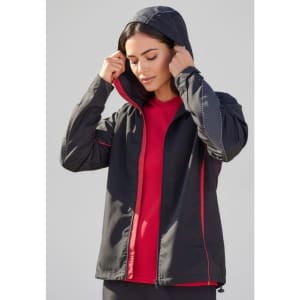 A unisex jacket in black with red accents and a hood, featuring a logo on the front.