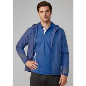 A man wearing a blue unisex jacket with a hood, paired with a blue polo shirt. The jacket features a logo.