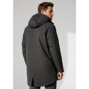 A man in a black unisex rain jacket with a hood, featuring a simple design and a slight split at the back.