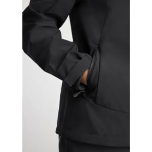 A black women's jacket with a close-up of the sleeve and pocket details, featuring a logo.