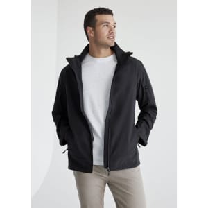 A man wearing a black rain jacket with a grey shirt underneath. The jacket has a logo on it.
