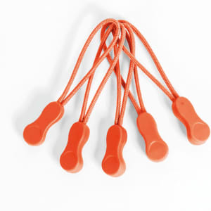 A set of five orange Zippies with attached elastic cords for securing clothing and other items.