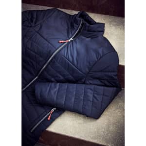 A navy quilted jacket with a high collar and a zippered front, featuring contrasting red zip details.
