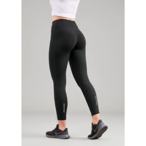 A pair of black women's leggings with a high waistband, featuring reflective accents on the lower legs.