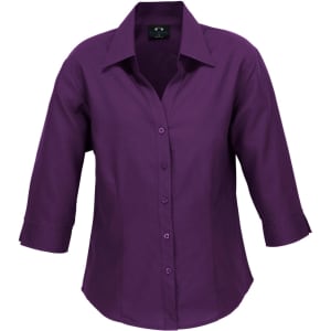 A purple women's 3/4 sleeve shirt with a collar and button-up front, featuring a logo.