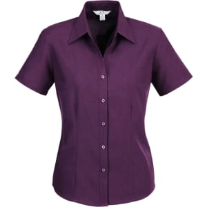 A short sleeve button-up shirt in a deep purple colour, featuring a collar and front buttons. It has a logo.