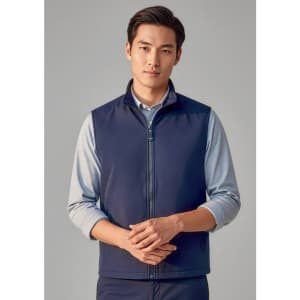 A navy unisex reversible fleece vest with a zip front and a logo on the chest, modelled by a man.