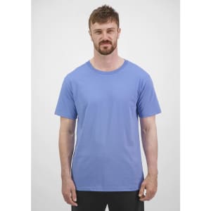A short sleeve tee in a light blue colour, featuring a logo and worn by a male model.