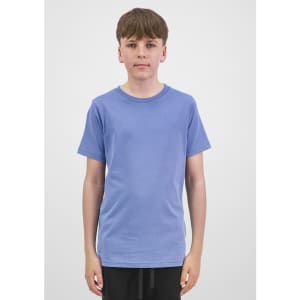 A young person wearing a short sleeve tee in light blue, standing against a plain background. The tee has a brand logo.