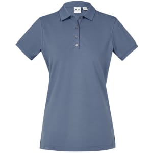 A women's short sleeve polo shirt in a soft blue colour, featuring a collar and button placket. It has a logo.
