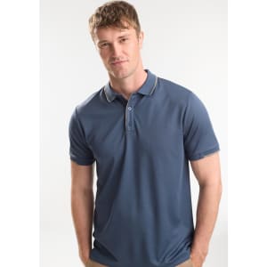 A men's short sleeve polo shirt in navy blue with a contrasting collar, featuring a logo on the chest.