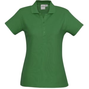 A green ladies' polo shirt with a classic collar and buttons, featuring a logo.