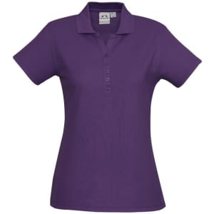 A purple ladies' polo shirt with a collared neck and button placket, featuring a logo on the chest.