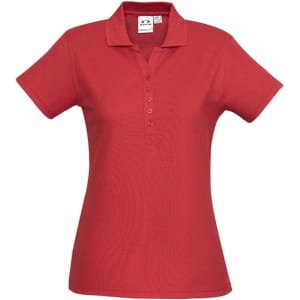 A red ladies' polo shirt with a collared neckline and short sleeves, featuring a logo.