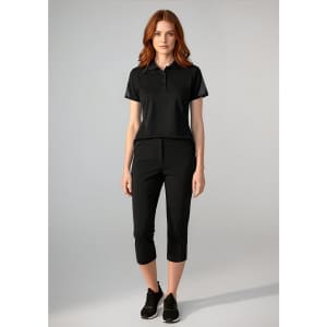A women's black short sleeve polo shirt displayed with matching black pants, featuring a logo on the polo.