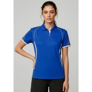 A women's short sleeve polo shirt in blue with white accents and a logo on the chest.