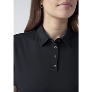 A women's short sleeve polo in black with a collar and button details, featuring a subtle logo.