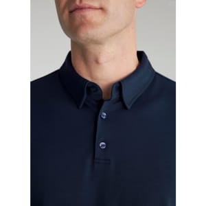 A navy short sleeve polo shirt for men with a classic collar and button placket, featuring a logo.