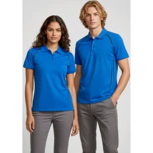 A blue short sleeve polo shirt for men, featuring a logo, styled with grey pants.