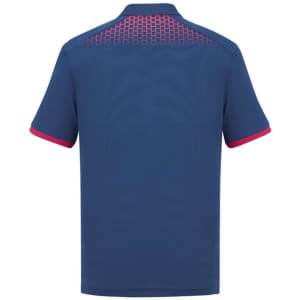 A navy blue men's polo shirt featuring a patterned design on the back and contrasting pink details. It includes a logo.