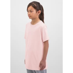 A light pink short sleeve tee is displayed on a young girl. The tee has a simple design and a loose fit.