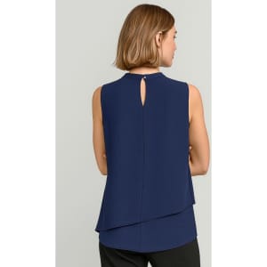 A navy blue sleeveless blouse with a layered design and a keyhole detail at the back. Features a branding logo.