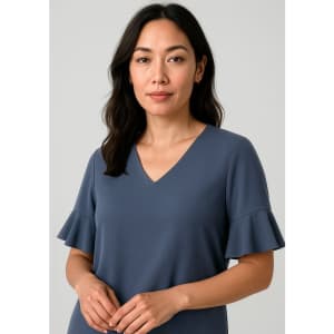 A fluted sleeve blouse in slate blue, featuring a V-neckline and a relaxed fit. The image has a branding logo.
