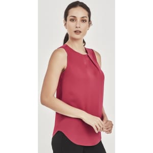 A sleeveless blouse in a rich red hue with pleat detail, featuring a round neckline and curved hem.