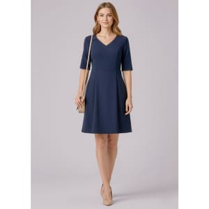 A navy short sleeve dress with a V-neck and a fitted waist, complemented by a neutral handbag.