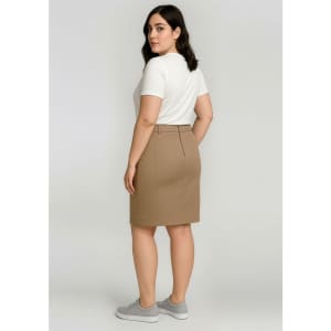 A mid-waist stretch chino skirt in a tan colour, paired with a white short-sleeve top. Features a rear view with a logo.