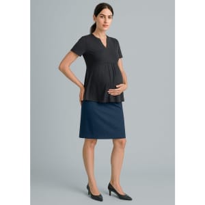 A maternity skirt in navy blue paired with a black top, displayed on a model with a baby bump.