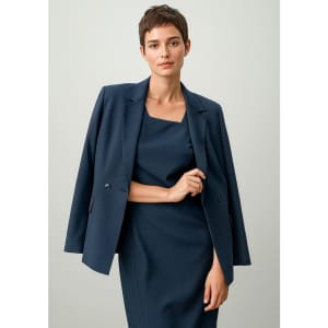 A double-breasted longline jacket in navy blue, featuring a tailored fit and structured silhouette.