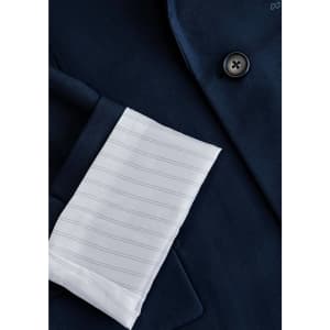 A navy jacket featuring a white striped cuff and a button detail, with a branding logo present.