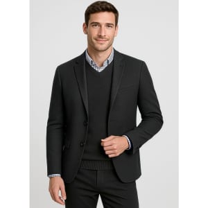 A tailored black blazer over a black sweater, paired with a checkered shirt underneath. The model is smiling.