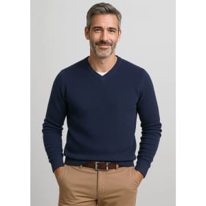 A navy knitted jumper featuring a V-neck design, worn by a smiling man with grey hair.