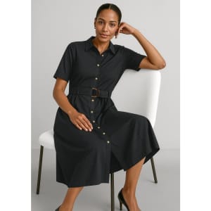 A black midi dress with short sleeves, a button-down front, and a belted waist, displayed on a seated model.